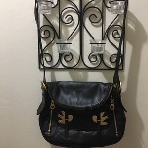 Black Marc Jacobs “Petal to the Metal” purse.